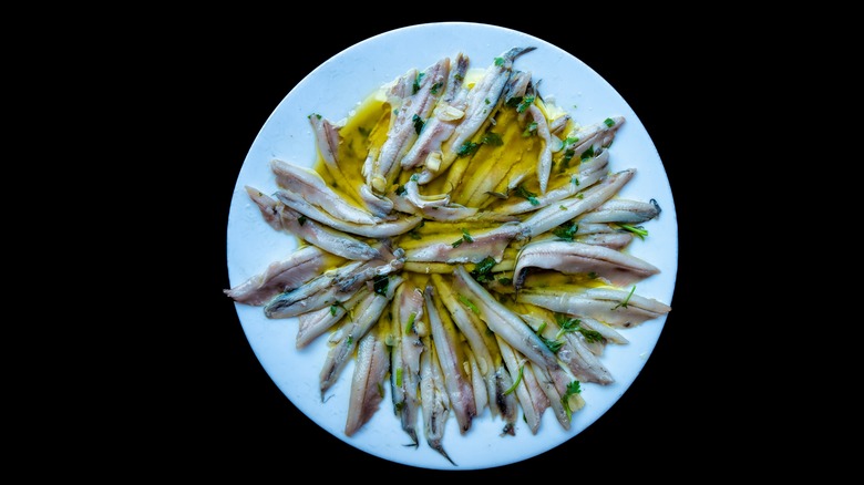 White plate of boquerones en vinagre