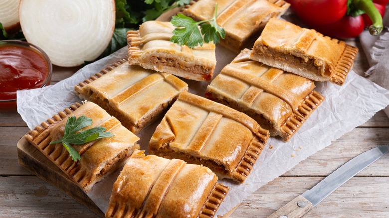Platter of empanada Gallega sliced into squares