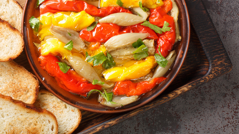 Bowl of escalivada with toast points