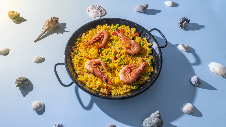 Paella surrounded by seafood