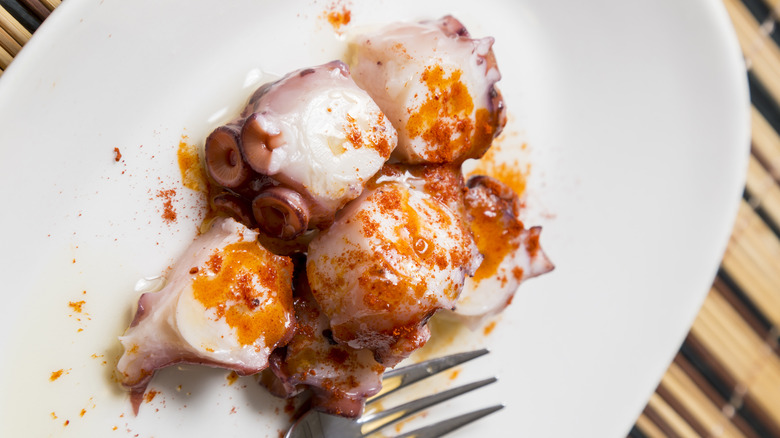 White plate of pulpo alla Gallega