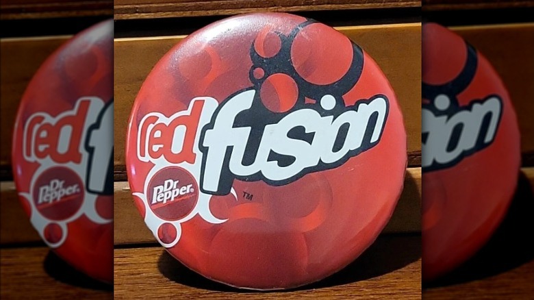 Dr Pepper Red Fusion pin against wooden background