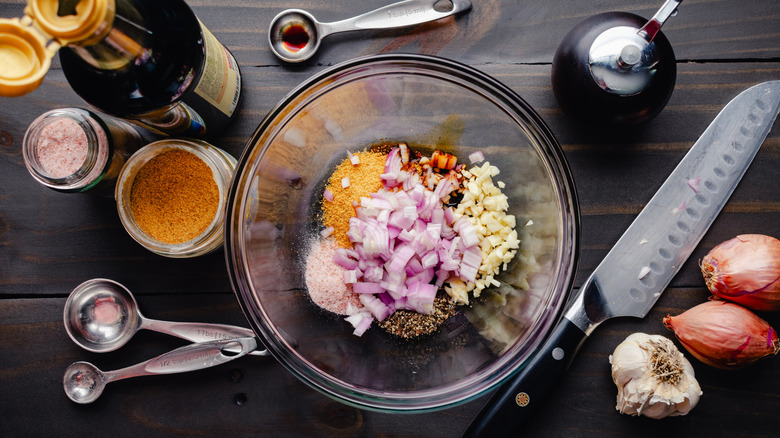 overhead shot of a flavorful marinate put together in a bowl with surrounding ingredients