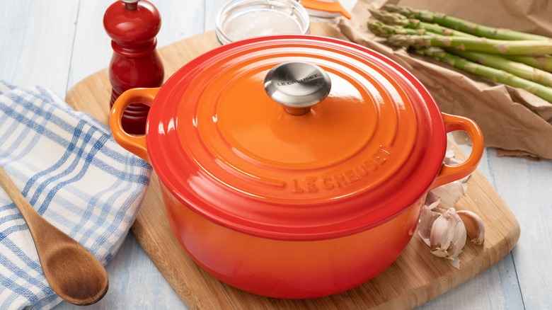 dutch oven on cutting board