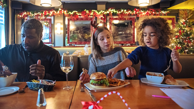 Family enjoying Christmas lunch in a restaurant