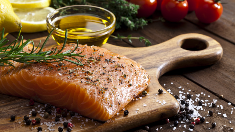 seasoned salmon on wooden board
