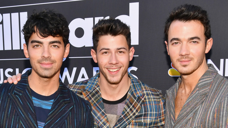 The Jonas Brothers pose at event