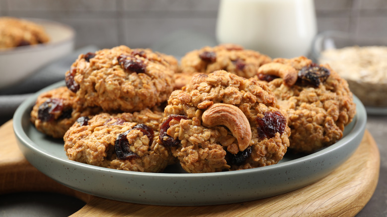 A bowl of oatmeal cookies with raisins and mixed nuts