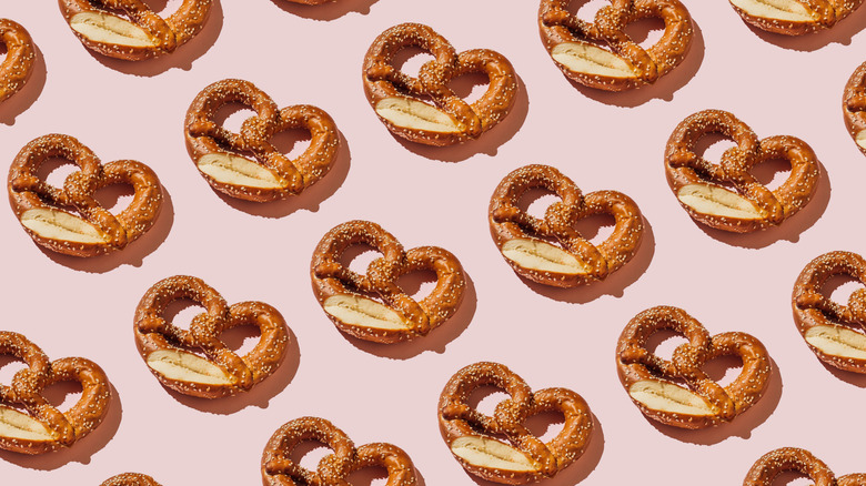 several pretzels on pink background