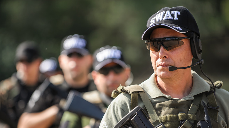 A SWAT team stands by
