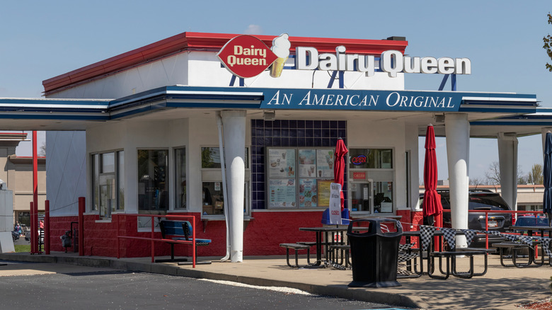 A vintage-styled Dairy Queen location with drive thrus on either side and a walk-up window in front