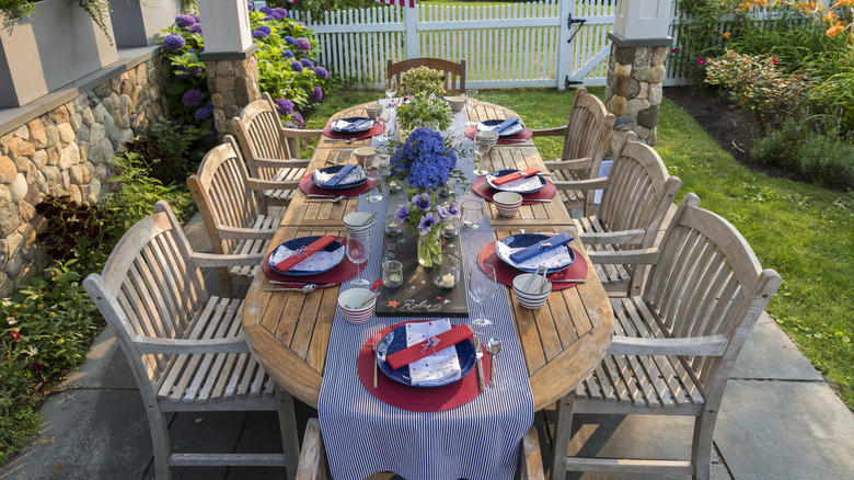 Backyard table set with red, white, and blue place settings