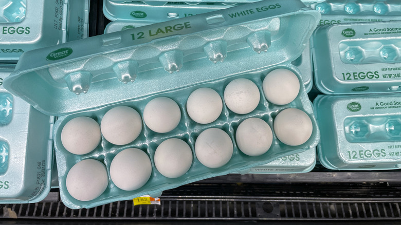 open carton of walmart-brand eggs