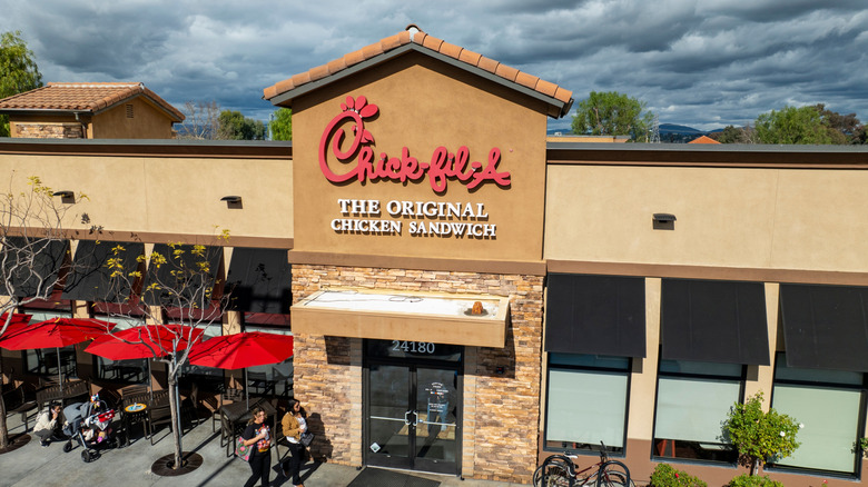 Chick-fil-A restaurant with outdoor seating on cloudy day
