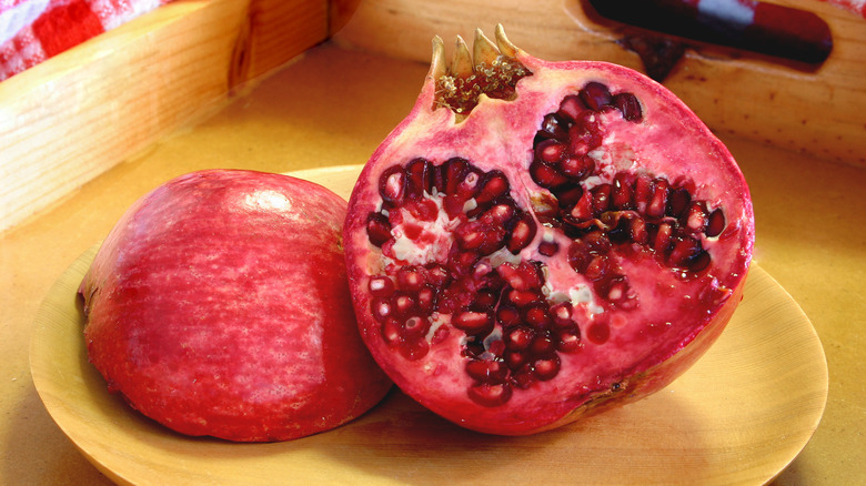 pomegranite cut in half on plate