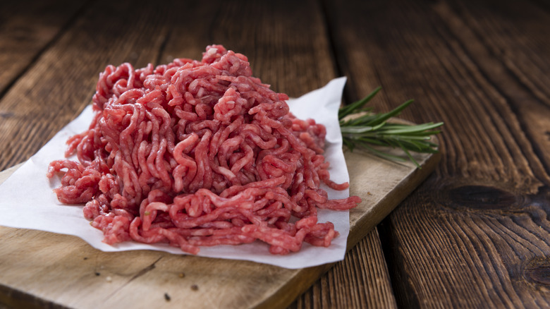 Ground beef on wooden board