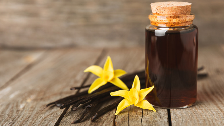 Vanilla extract in glassware on a wooden table