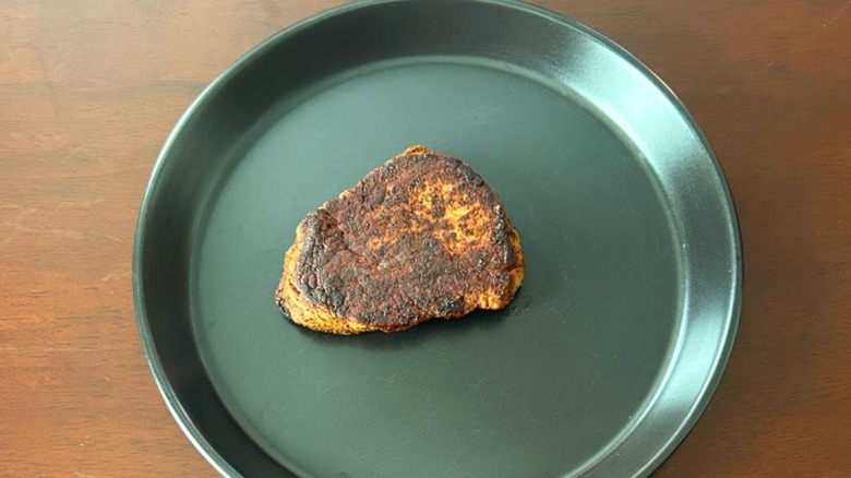 Outback Steakhouse filet mignon on a black plate