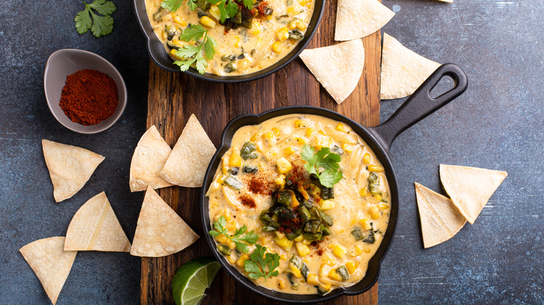 Overview of queso with chips and seasoning