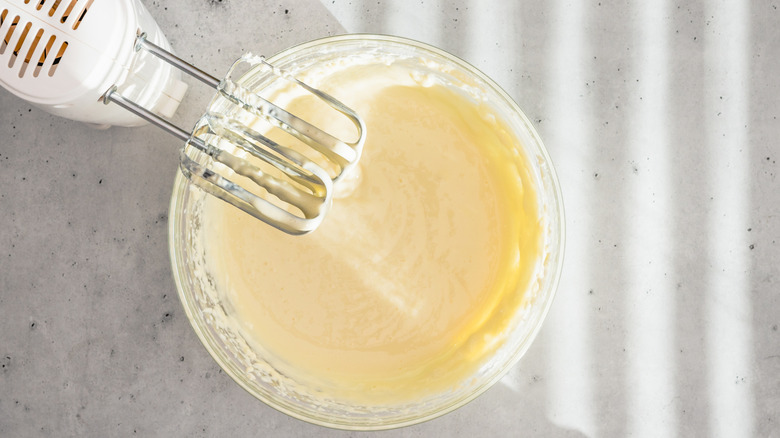 Cheesecake batter in bowl with mixer