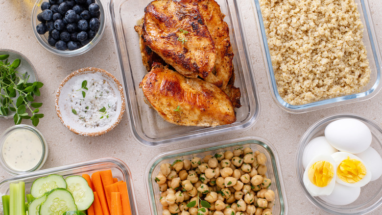Glass containers full of various foods on countertop