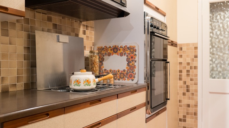 1970s kitchen with multicolored tile and floral accents