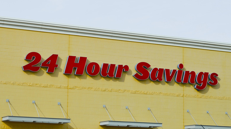 WinCo Warehouse with 24 Hour Savings Sign