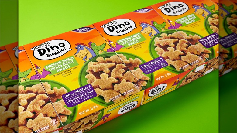 Row of Yummy Dino Buddies boxes on a green background