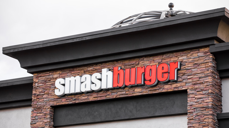 exterior view of a Smashburger with a white and red logo.