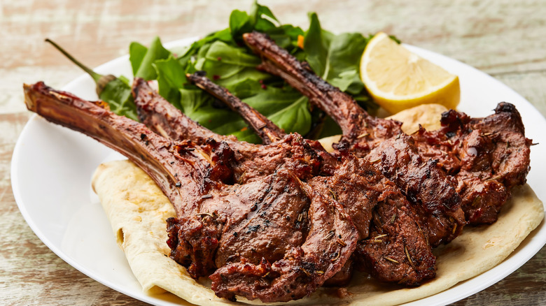 Lamb chops on pita with salad