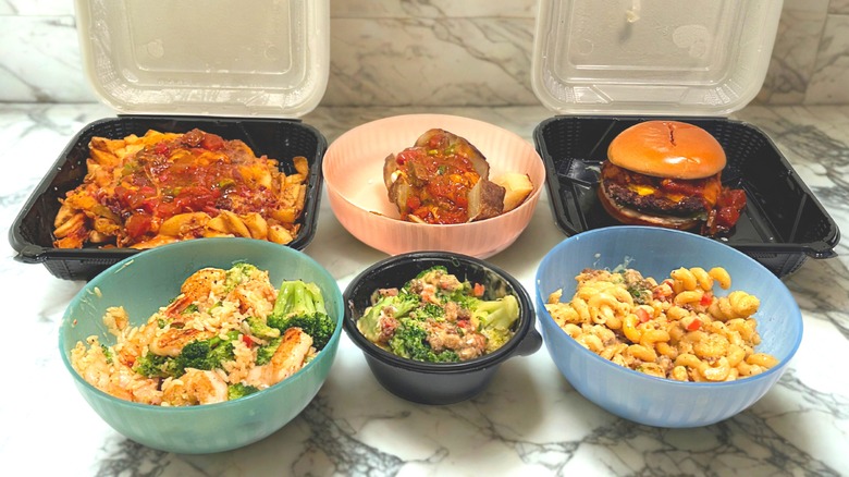 Six Outback Steakhouse secret menu items on a marble countertop