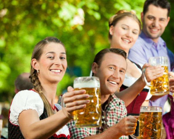Revelers celebrate Oktoberfest in traditional garb.