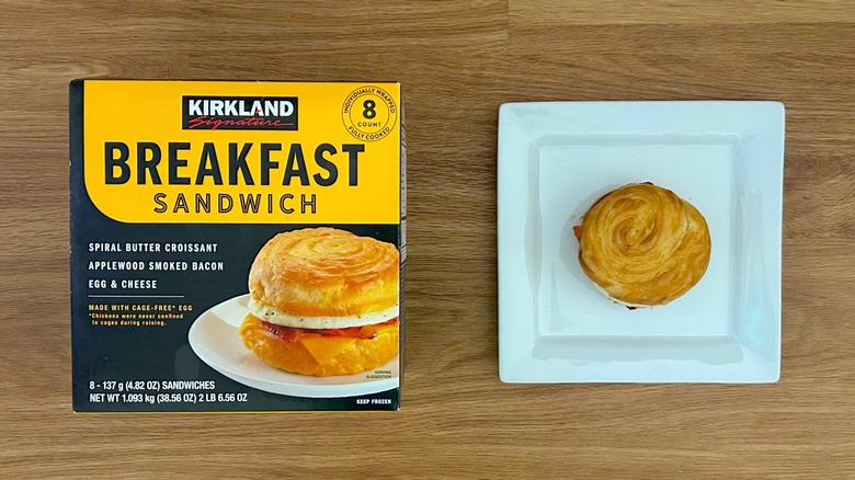 Package and serving of Kirkland Signature Breakfast Sandwich on square white plate