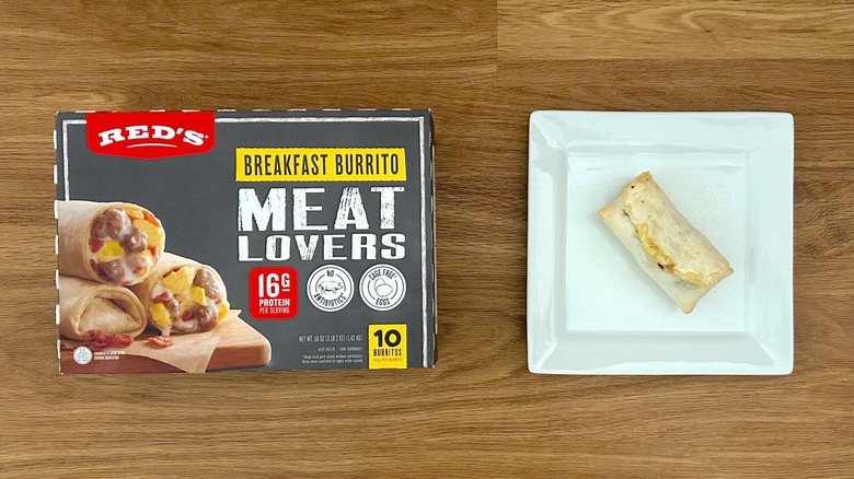 Package and serving of Red's Breakfast Burrito Meat Lovers on square white plate