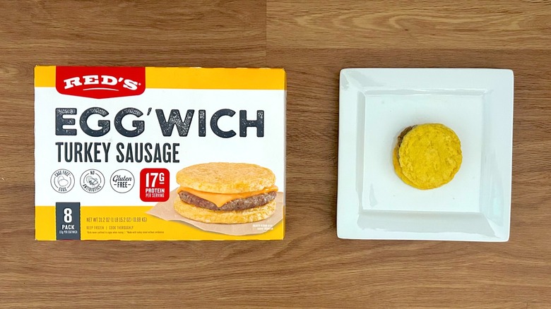 Package and serving of Red's Egg'wich Turkey Sausage on square white plate