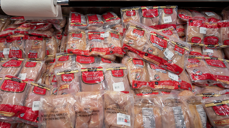 Bags of Costco Kirkland Signature chicken breasts on display in store