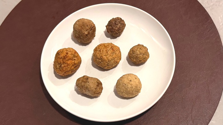 7 different turkey meatballs on a plate