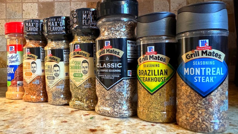 lineup of various steak seasoning bottles