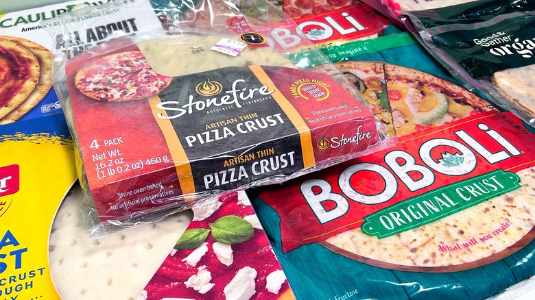 Close up image of seven different store bought pizza crusts