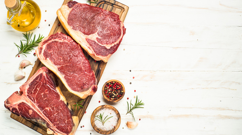 steak surrounded by seasonings 