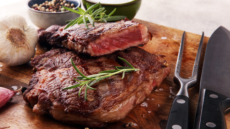 sliced dried steak on board