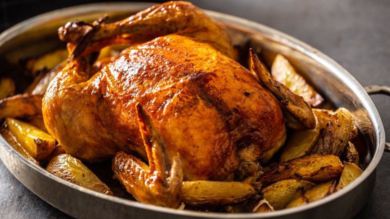 chicken in pan with potatoes