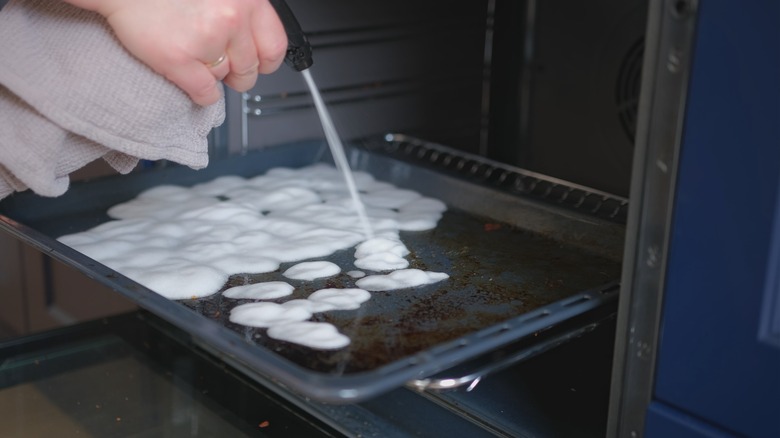 Spray bottle spray on baking sheet