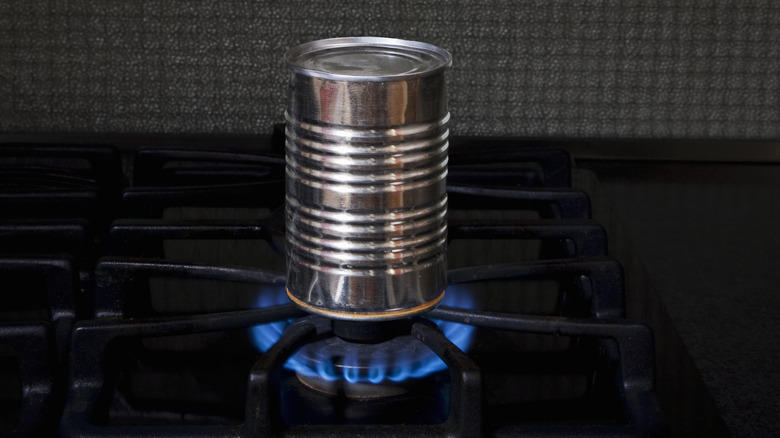 A can placed directly on a stove top