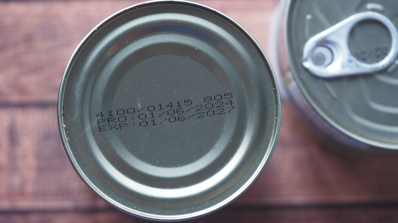 A can with production and expiry date displayed on top