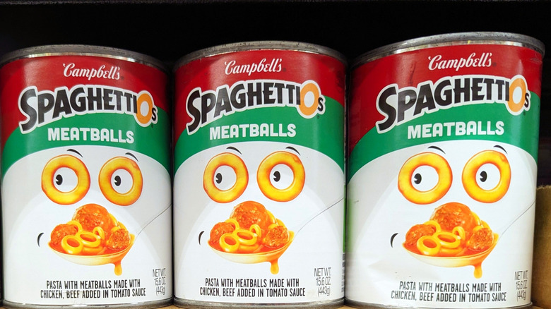 Three cans of SpaghettiOs with meatballs stacked next to each other
