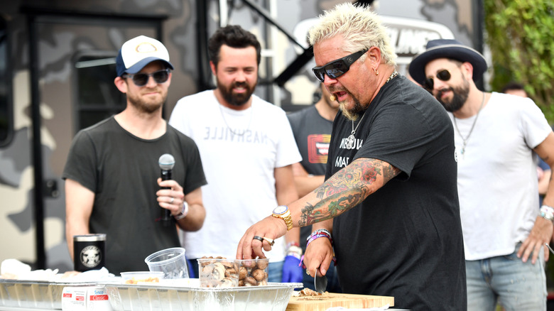 Guy Fieri cooking for people