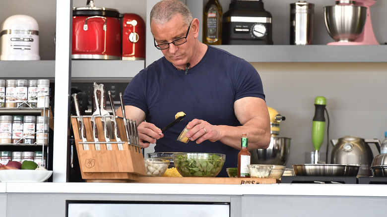 Robert Irvine holding knife