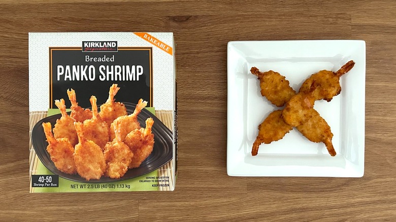 Kirkland Signature Breaded Panko Shrimp package and cooked shrimp on white square plate