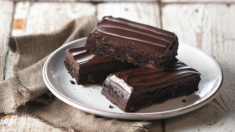Frosted brownies on plate